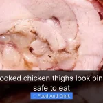Why do cooked chicken thighs look pink and is it safe to eat